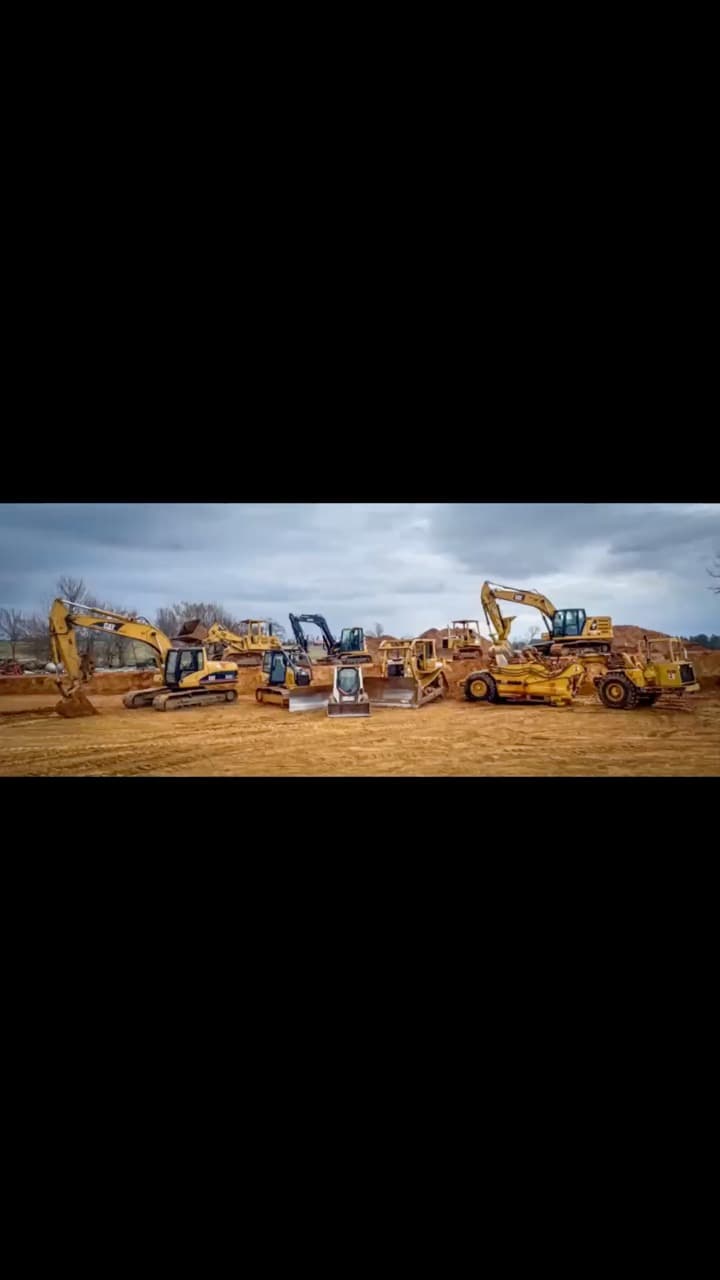 The Wilkins Excavating equipment fleet lined up on a jobsite
